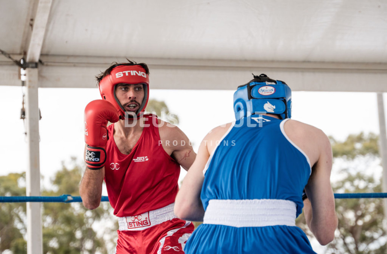 Amateur boxing match, red corner and blue corner sparring